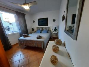 A bed or beds in a room at Tramuntana 37, 1°