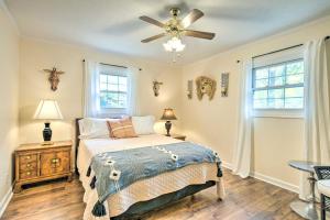 a bedroom with a bed and a ceiling fan at Lovely Taylors Home 8 Mi to Dtwn Greenville! in Greer