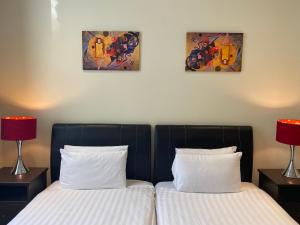 Cama o camas de una habitación en Grand Plaza Serviced Apartments