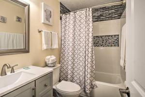 a bathroom with a sink and a toilet and a shower at Sauna and Game Room Lake House in Locust Grove! in Wilderness +29 photos