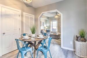 a dining room with a table and blue chairs at Pet-Friendly Indianapolis Townhome with Yard! in Indianapolis