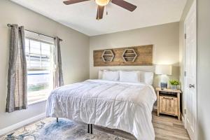 a bedroom with a bed and a ceiling fan at Pet-Friendly Indianapolis Townhome with Yard! in Indianapolis