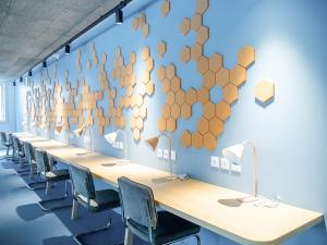 a conference room with a long table with chairs at Ecla Paris Noisy-le-Grand in Noisy-le-Grand