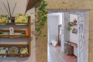 a room with a wall with a bunch of items on it at Ostello-Albergo dagli Elfi in Barrea