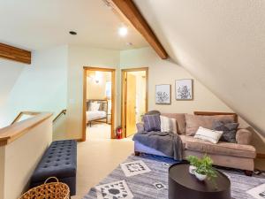 a living room with a couch and a table at Heliotrope Haus in Glacier