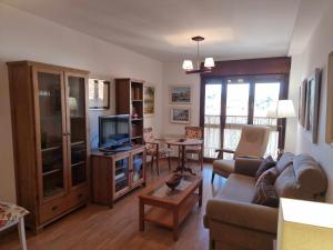 TV a/nebo společenská místnost v ubytování Apartamento vacacional Marita