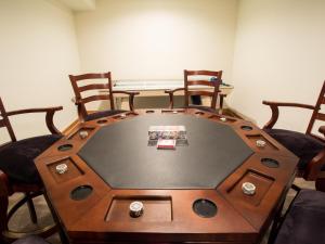 a table in a room with chairs around it at Silver Peak Lodge in Glacier