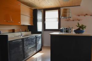 a kitchen with a sink and a counter top at casale dei cinque colli APPARTAMENTO in Ostra