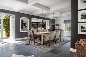 a dining room with a table and chairs at 14 on Klein Constantia in Cape Town