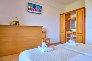 Posteľ alebo postele v izbe v ubytovaní Nikos Kalamaki Corfu