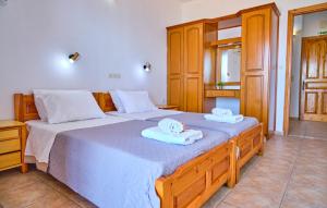 Posteľ alebo postele v izbe v ubytovaní Nikos Kalamaki Corfu