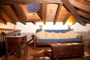 a living room with a blue couch and a table at La Breval in Alles +20 photos