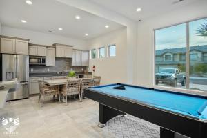 a kitchen with a pool table in a room at Zion Village Elements Earth in Hurricane