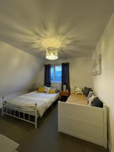 a bedroom with two beds and a ceiling at Holiday home, Tywyn, newly refurbished, great location in Tywyn