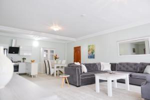 a living room with a couch and a table at Atlantic Luxury Apartments in Bakau