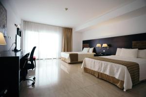 Letto o letti in una camera di Hotel Balandra
