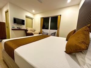 Letto o letti in una camera di Hotel Ramakrishna