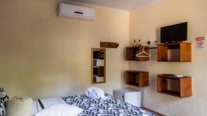 Postel nebo postele na pokoji v ubytování Villa Residencial Encantos Da Mata