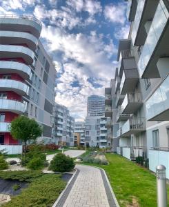 a view of an apartment complex with buildings at Downtown Apartments Monroe in Rzeszów