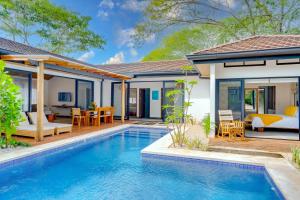 an image of a villa with a swimming pool at Calle 1 - 29 Tamarindo in Tamarindo