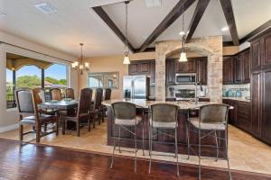 an open kitchen and dining room with a table and chairs at Lakeview Villa-we have boat rentals too! in Canyon Lake