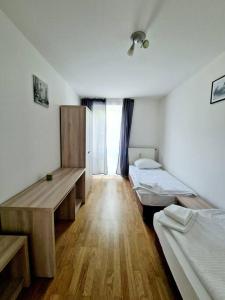 a room with two beds and a window at Apartment in the heart of Berlin 2122 in Berlin