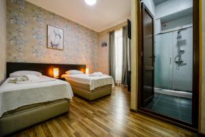 Postel nebo postele na pokoji v ubytování Hotel Guri