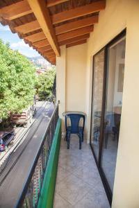 a balcony of a house with a chair on it at Apartamento en Envigado in Envigado