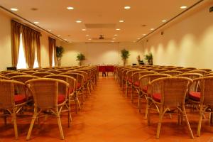 an empty room with chairs and a table at Lam Hotel Convento do Desagravo in Oliveira do Hospital +80 photos