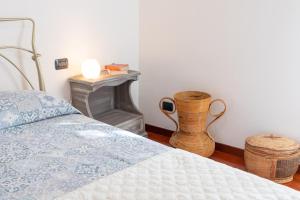 A bed or beds in a room at Acquamarina