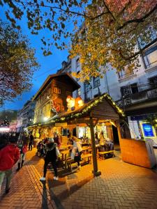 a group of people walking down a street with a gazebo at Stay Inns in Birmingham