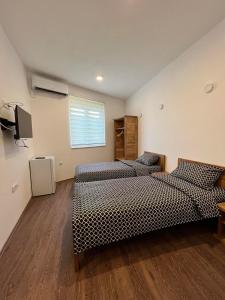 Postel nebo postele na pokoji v ubytování Rooms & Spa BJELASICA