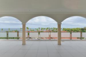 a view of the water from the balcony of a building at Atlantic Luxury Apartments in Bakau