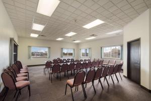 a room with a bunch of chairs in it at Motel 6-Rothschild, WI in Rothschild