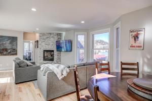 a living room with a couch and a table at Just Walk Inn Townhome: Stroll To Main St, Gondola in Breckenridge