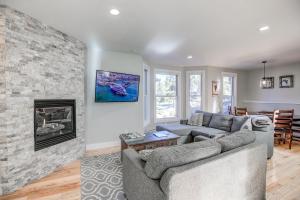 a living room with a couch and a fireplace at Just Walk Inn Townhome: Stroll To Main St, Gondola in Breckenridge