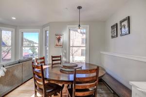 a kitchen and dining room with a table and chairs at Just Walk Inn Townhome: Stroll To Main St, Gondola in Breckenridge