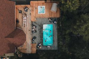 an overhead view of a swimming pool with people on it at Chalet Blue Jay Spa at Fiddler's Lake in Mille-Isles