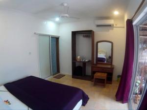 Letto o letti in una camera di Maafushi View