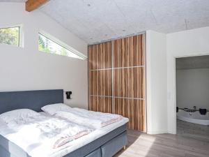 Postel nebo postele na pokoji v ubytování Luxury Spa Retreat in Arrild - By Traum Ferienwohnungen