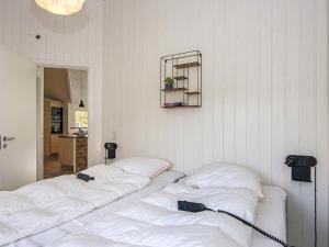 Postel nebo postele na pokoji v ubytování Luxury Spa Retreat in Arrild - By Traum Ferienwohnungen