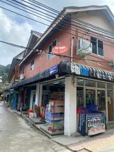 a store on the side of a building at Pak Klong Room for rent in Phi Phi Don