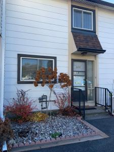 a house with a small tree in the front yard at Ottawa's Top Destination in Ottawa