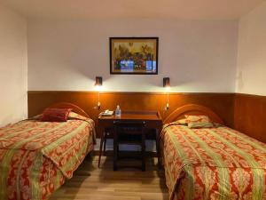 Rúm í herbergi á Saphi Inn Cusco - Excelente ubicación