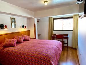 Rúm í herbergi á Saphi Inn Cusco - Excelente ubicación