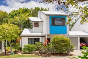 a white house with blue accents at Modern & Stylish 2 Bedroom Townhouse in Noosaville