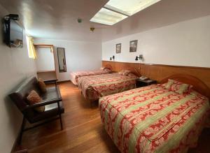 Rúm í herbergi á Saphi Inn Cusco - Excelente ubicación