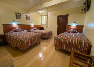 Rúm í herbergi á Saphi Inn Cusco - Excelente ubicación
