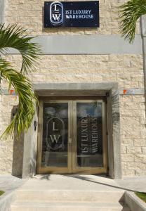 a door to a building with a sign on it at 1st Luxury Warehouse in Cancún