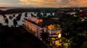an aerial view of a building with a river at The Nest Hotel Nusa Dua in Nusa Dua